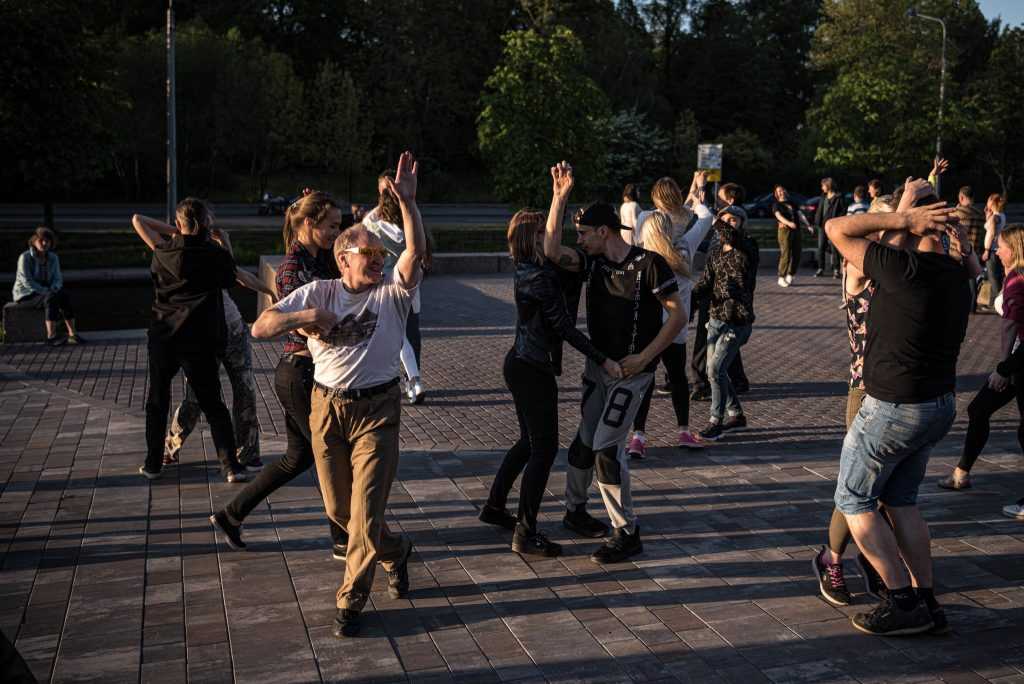 Dancing in St. Petersburg on a sunny evening last month. Russia, with more than 500,000 reported cases, has the third-highest number of infected people after the United States and Brazil.